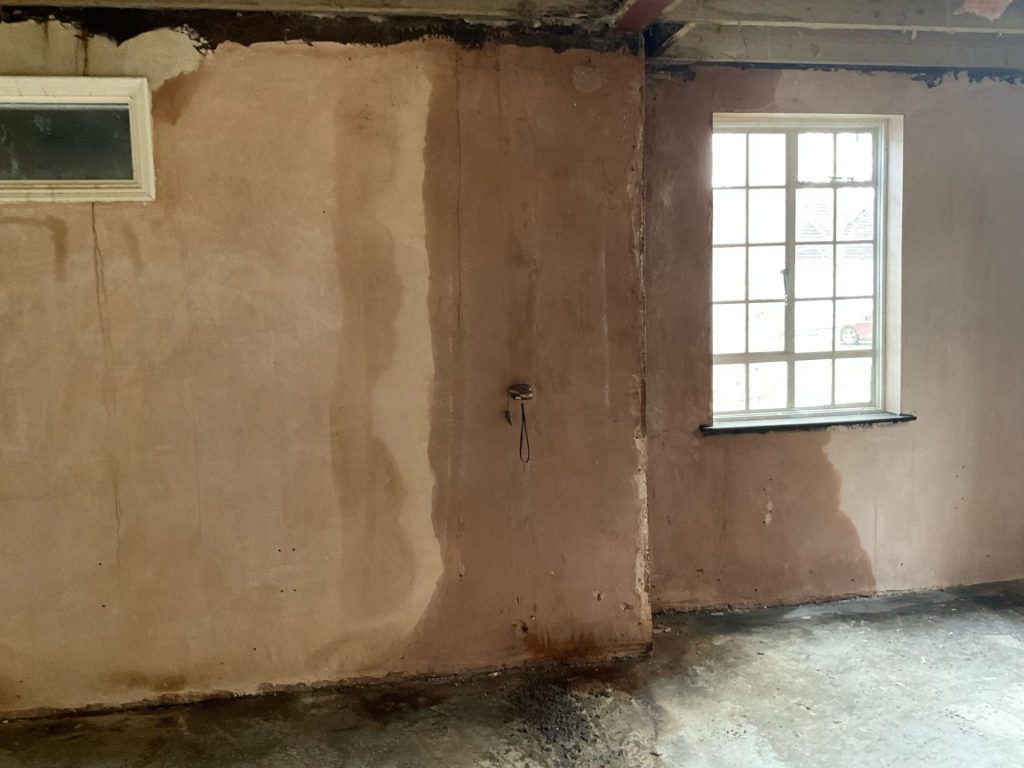 Damp stains on interior wall surface in a property in Orpington.