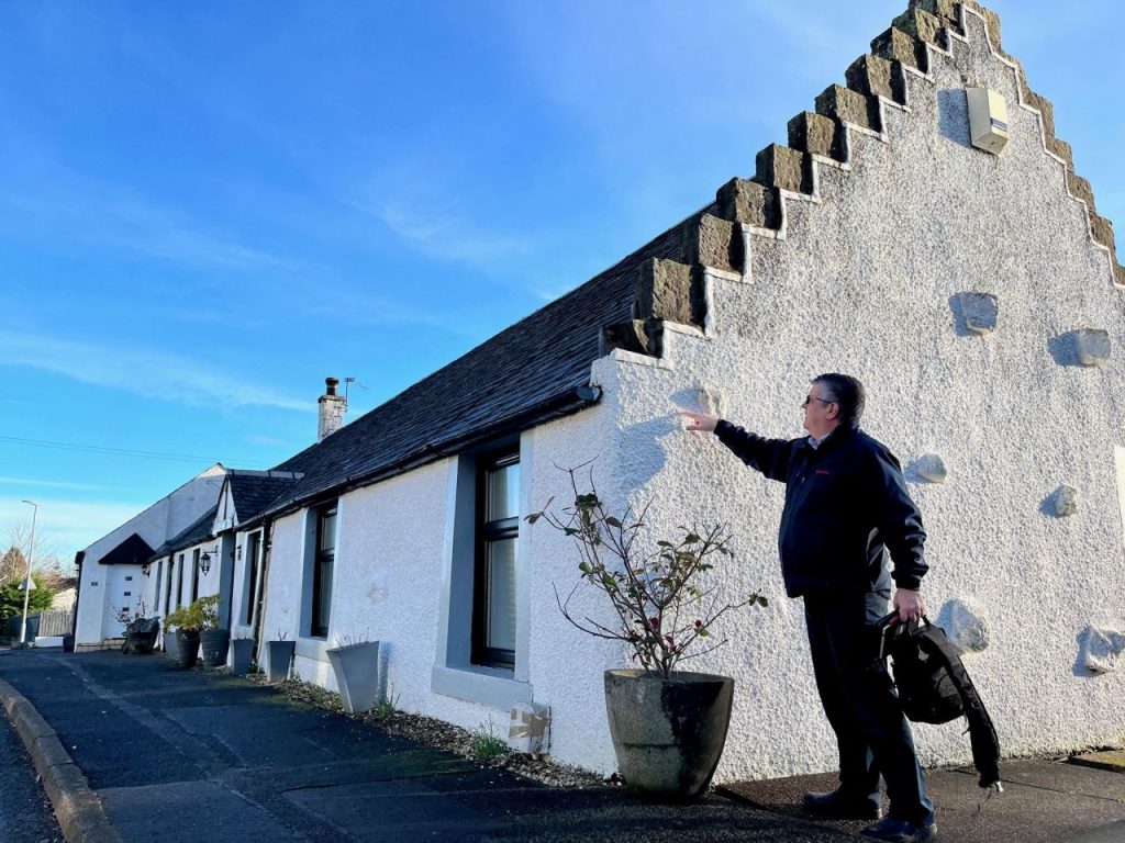 Timberwise surveyor inspecting a Glasgow property for damp