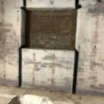 Damp damage to walls caused by poor basement waterproofing in Liverpool.