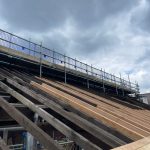 Rafters replaced with new timber. Scaffolding set up above the canopy to allow safe access to the roof timbers. Some old rafters have been deemed safe to remain, the resulting canopy is a mix of new and old timbers for a structurally sound roof.