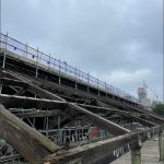 The external canopy of the property. Decayed timbers have been identified and removed, leaving only the safe, structurally sound timbers. No new rafters have been inserted yet. Scaffolding has been set up to allow safe access to the top of the roof.