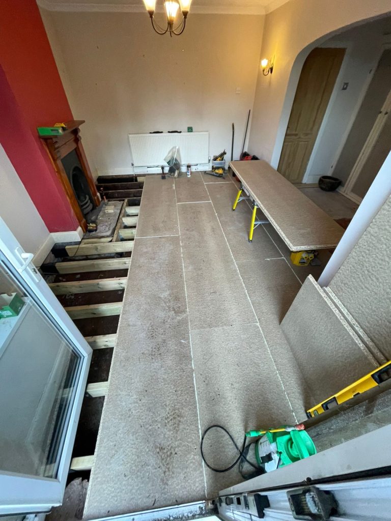 an ongoing chipboard installation in a ground floor reception room