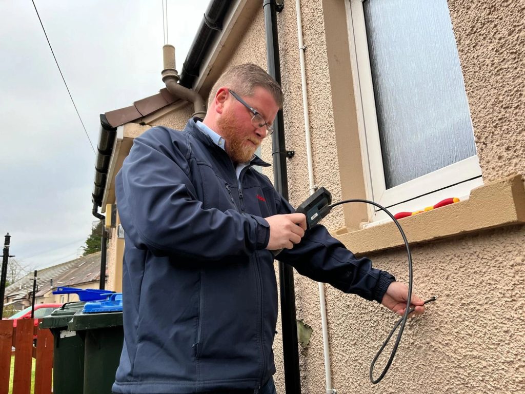 Timberwise surveyor inspecting wall in Perth for dampness.