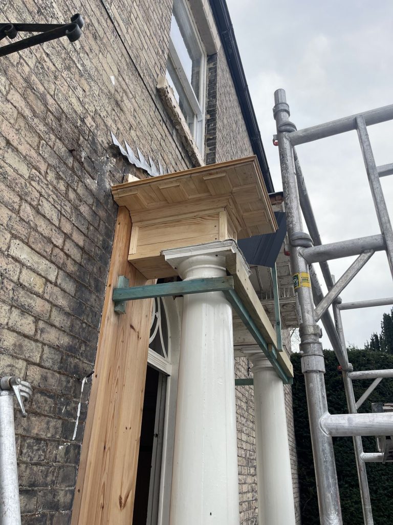 Column cap installation on building facade in Gainsborough, Lincoln