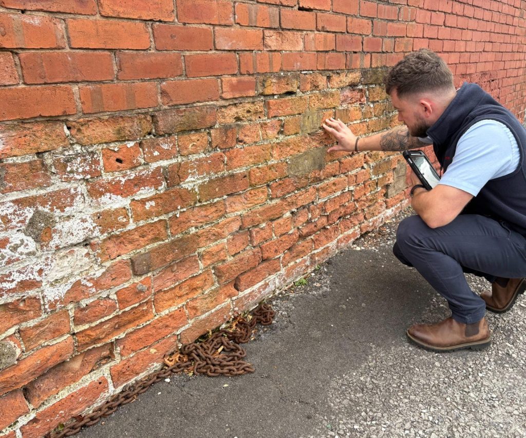 Commercial Structural Repair Surveys in London: What They Include & Why They Save Money 2 Surveyor examining damaged brickwork and mortar decay