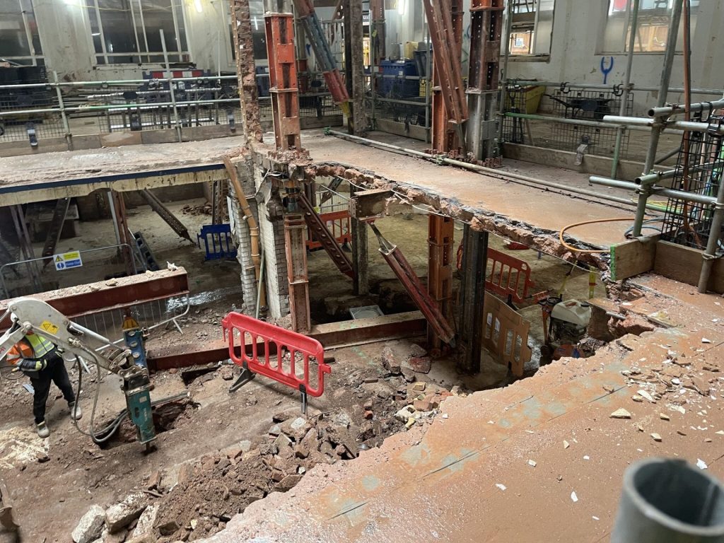 Commercial Concrete Damage in London: Causes, Risks & Repair Solutions 26 An exposed beam of concrete during repair work