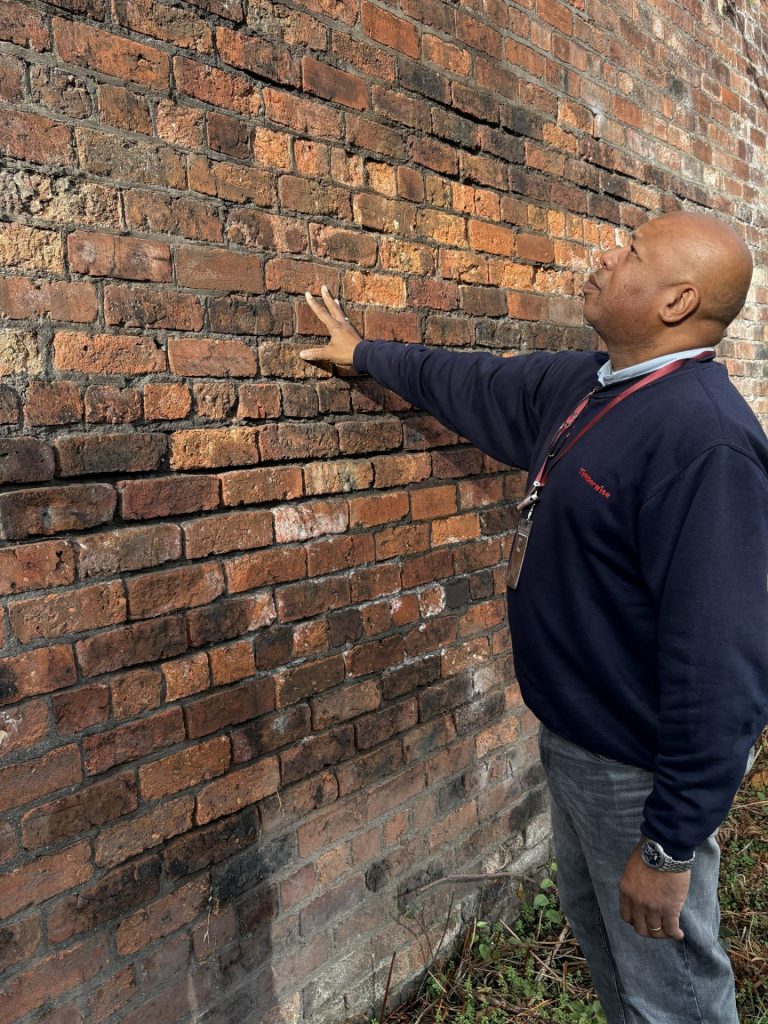 The Seven Signs of Rising Damp in London Homes 7 timberwise surveyor examining damp wall Timberwise