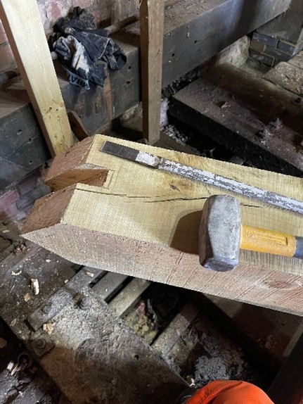 hand tools on an oak timber beam