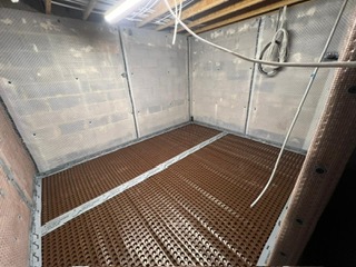 cavity drainage membrane installation in a basement