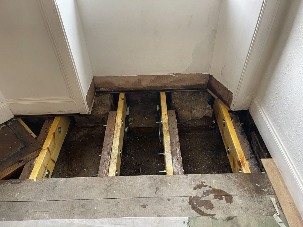 Exposed floor joists undergoing structural repair work in Edinburgh