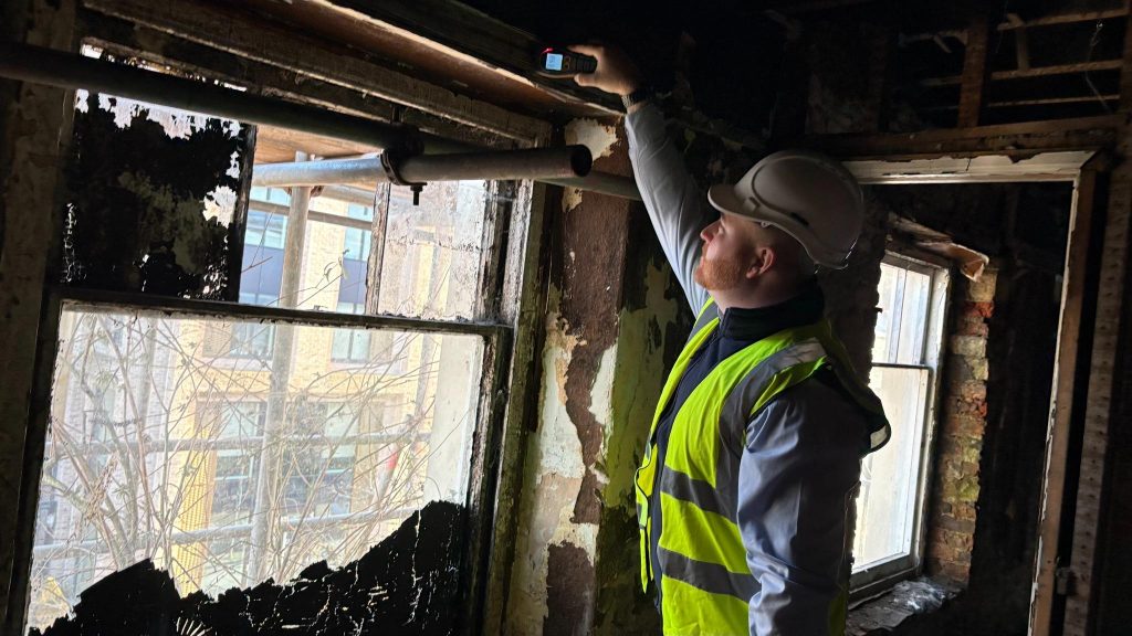 The Practical Benefits of Choosing a PCA Contractor 3 A Timberwise surveyor assessing an internal timber window