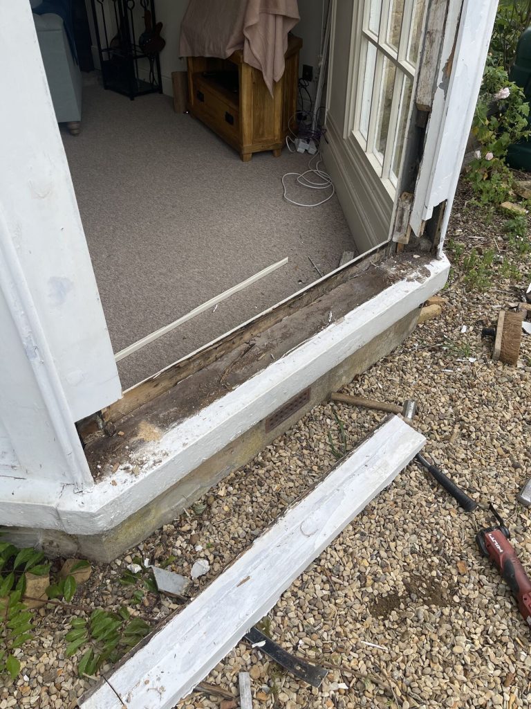 Is it Better to Repair or Replace My Timber Windows? 2 A plank of rotten wood removed from a bay window