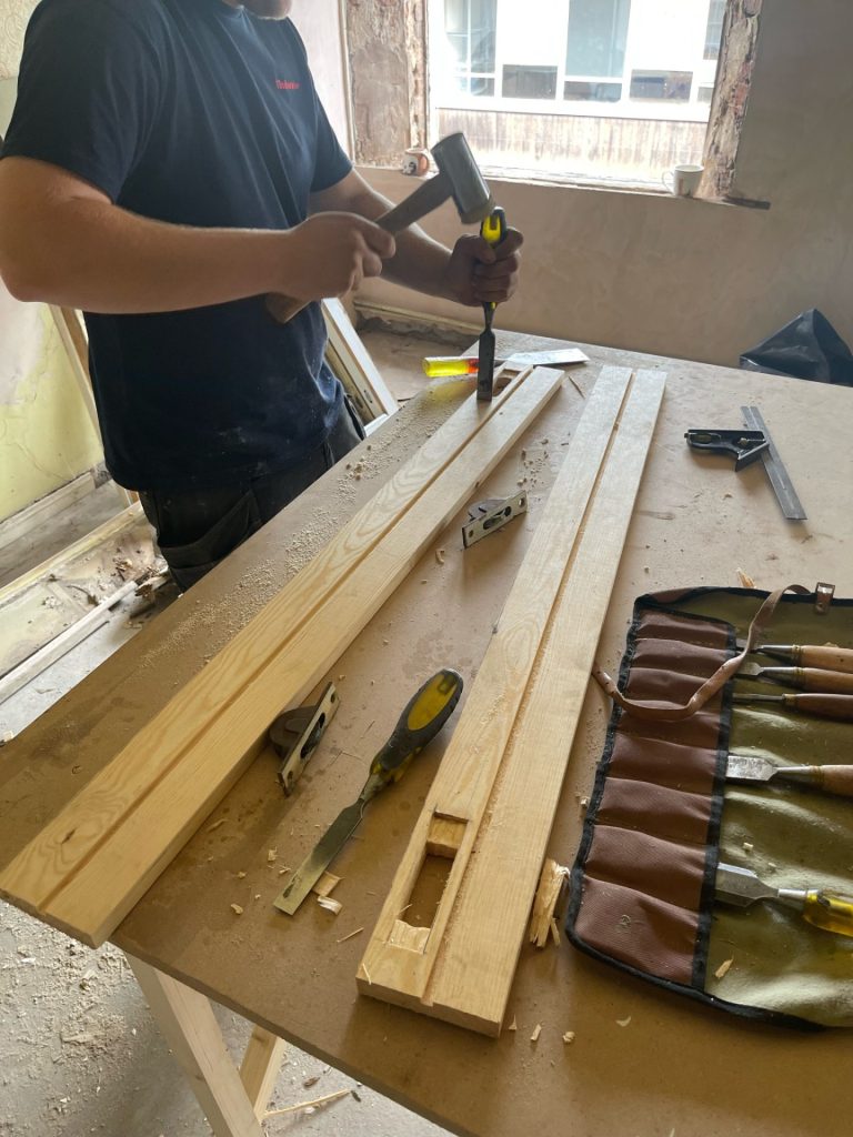 Is it Better to Repair or Replace My Timber Windows? 5 A Timberwise technician crafting a piece of timber for a timber window repair